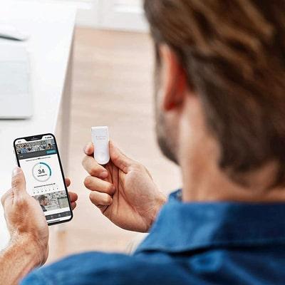 Image of user with smartphone viewing the 8sense app
