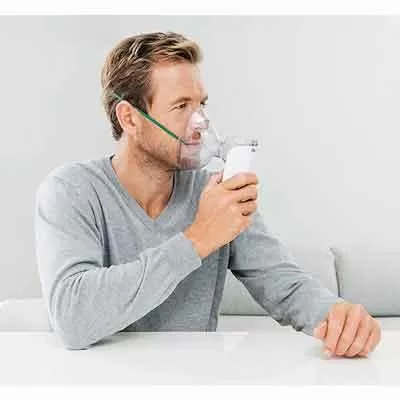 Image of user nebulising with adult mask  