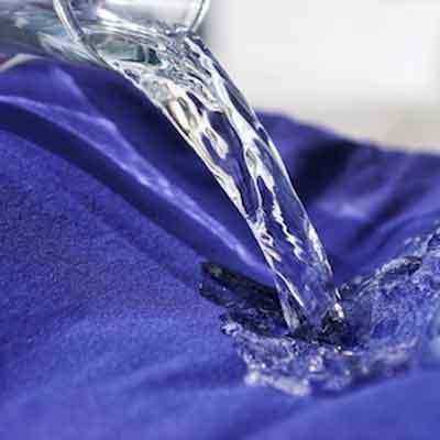 Image of water spilled over waterproof absorbent Pjama fabric 